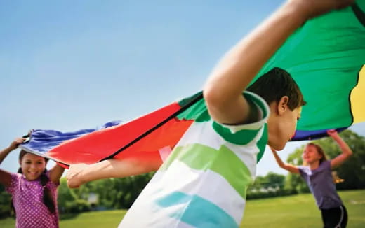 a group of children holding a flag