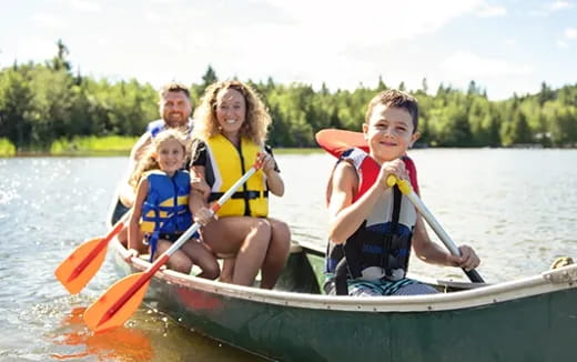 a group of people in a canoe