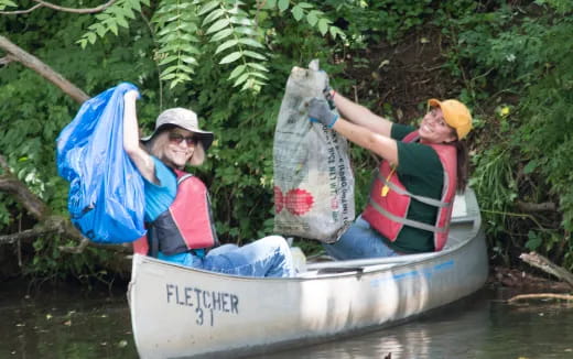 a couple of people sit in a boat