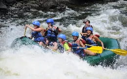 a group of people in a raft