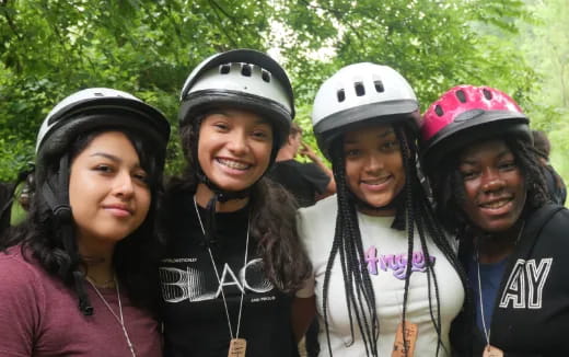 a group of people wearing helmets