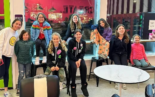 a group of people standing and sitting