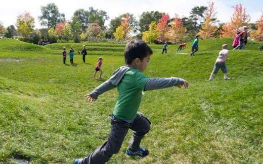 a group of kids playing in a field