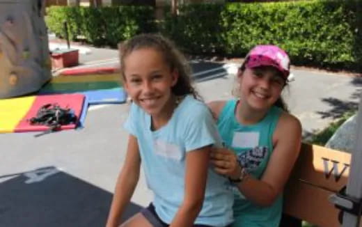 a couple of girls posing for the camera