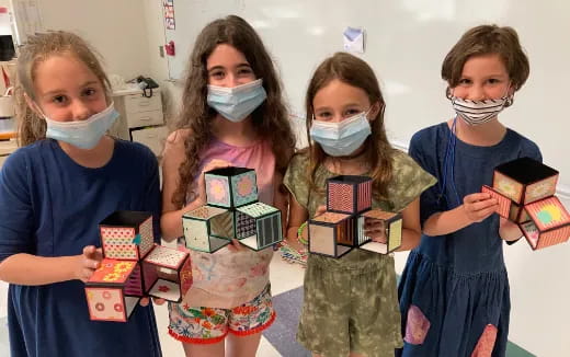 a group of children wearing face masks
