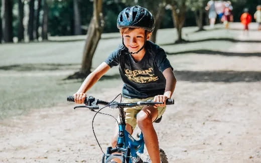 a boy riding a bike