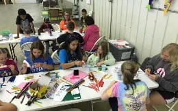 a group of people sitting at tables