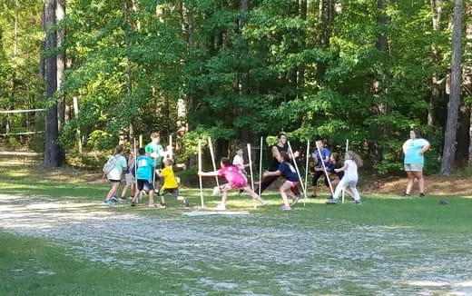 a group of people playing in a park