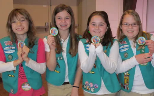 a group of girls holding up their hands