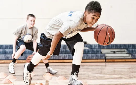 a few boys playing basketball