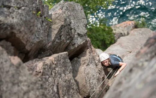 a man climbing a rock