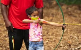 a person and a child holding a rope