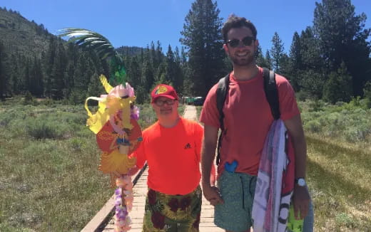 a group of men holding a kite
