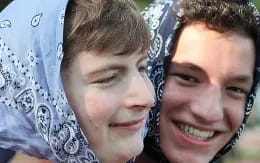 a man and woman smiling