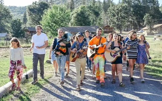 a group of people walking on a path