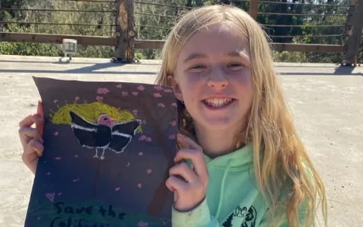 a girl holding a book