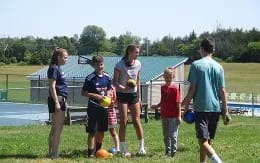 a group of people playing football