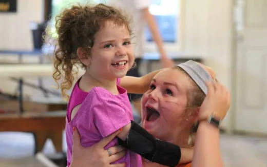 a person holding a baby