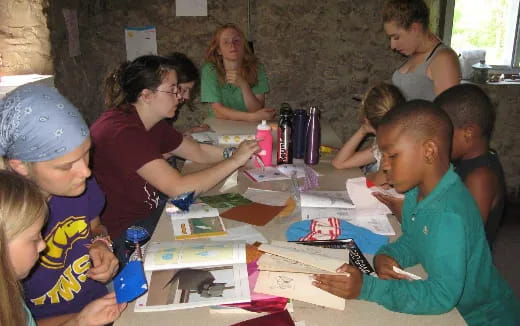 a group of people sitting around a table