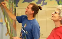 a person with the arms raised