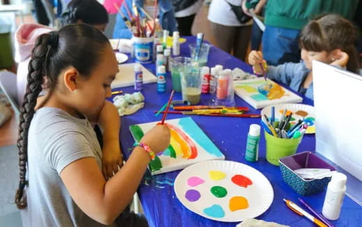 a group of children painting