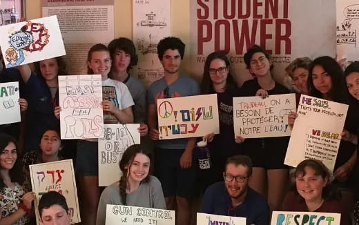 a group of people holding signs