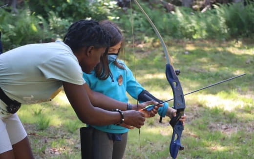 a person shooting a bow