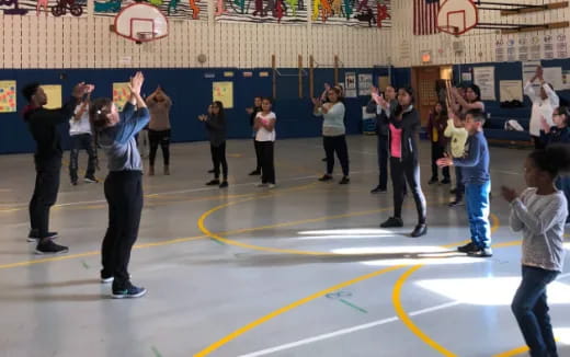 a group of people in a gym