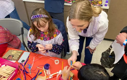 a group of children painting