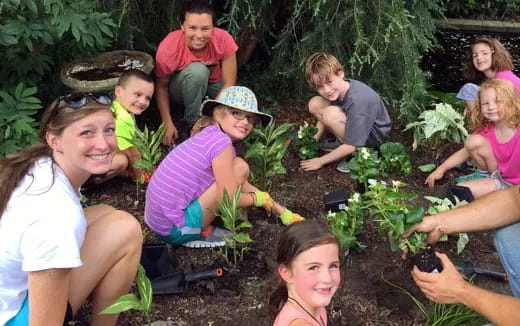 a group of people in a garden