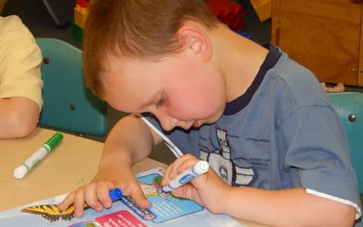 a young boy painting