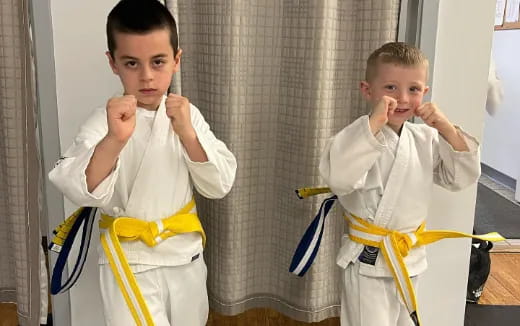 a boy wearing a karate uniform