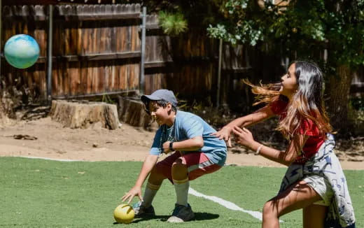 a man and a woman playing football