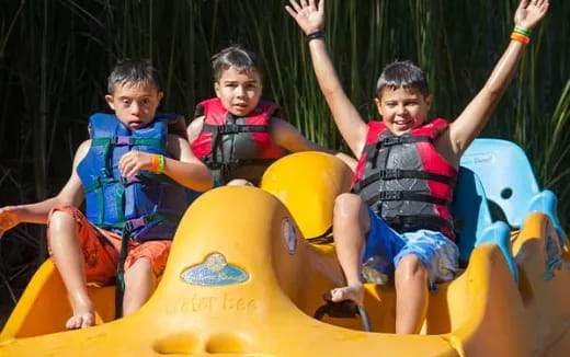 a group of kids on a ride