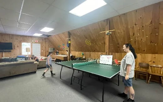 a man playing pool in a room