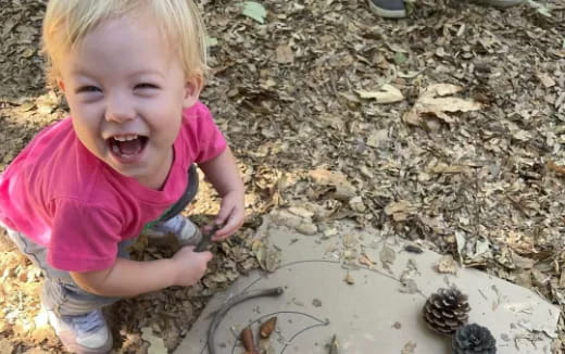 a child playing with a turtle