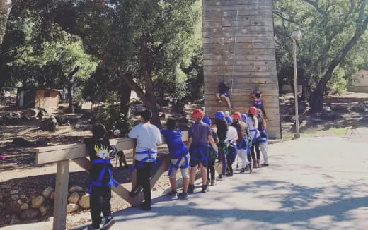 a group of people walking on a road