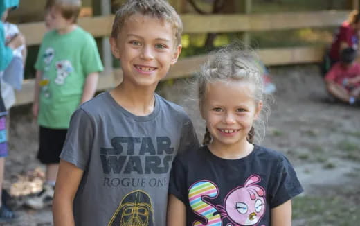 a boy and girl smiling