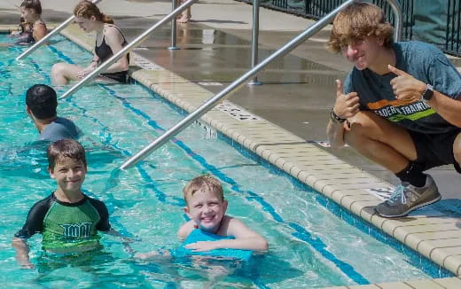 a group of people in a pool