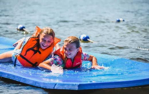 a couple of women in a pool