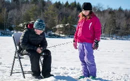 a person and a child in the snow