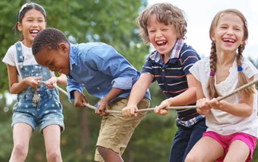 a group of children playing with a toy