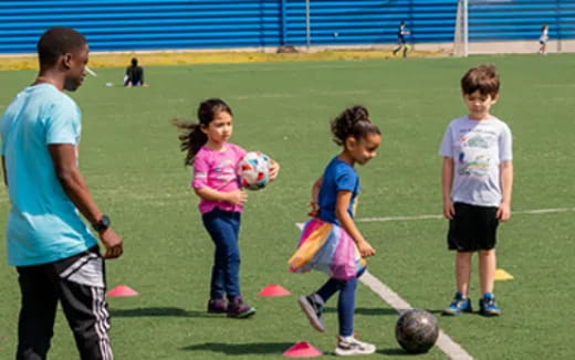 a group of kids playing football