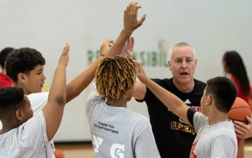 a group of people raising their hands
