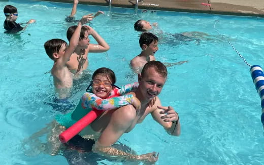 a group of people in a pool