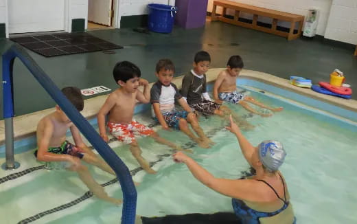 a group of people in a pool