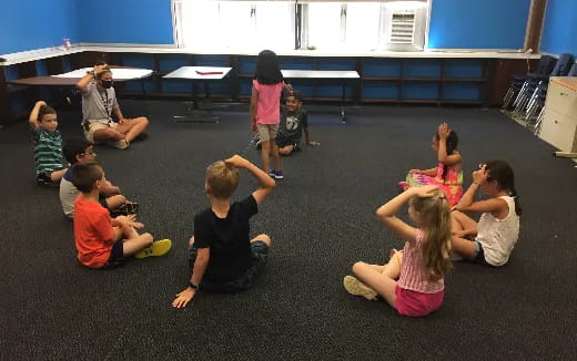 a group of children sitting on the floor