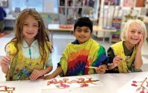 a group of people painting