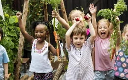 a group of children holding flowers