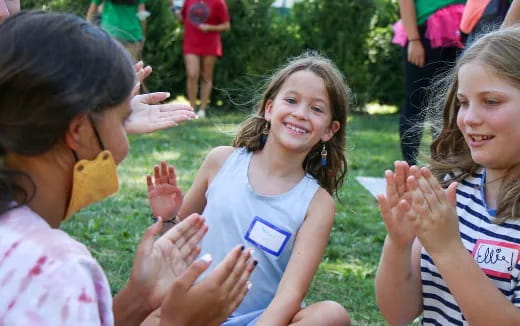 a group of children clapping